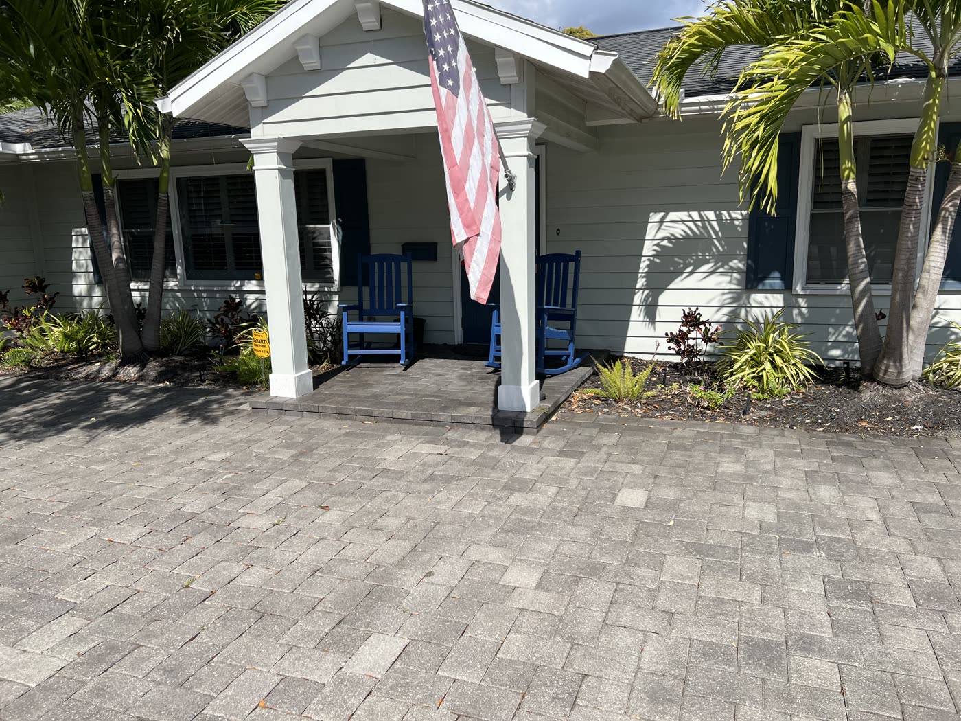 Paver driveway and refreshed front landscaping at a North Port home