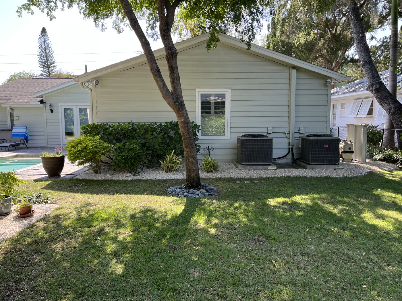 Backyard lawn and landscape beds at a North Port home